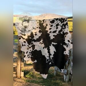 Stunning Brazilian Black and White cowhide rug. NWOT